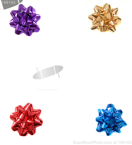 Image of Four colorful Christmas bows in the four corners of an isolated