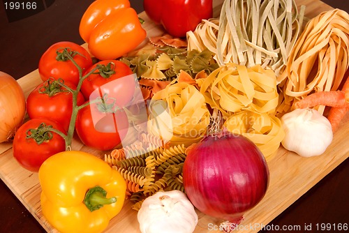 Image of A bounty of Italian foods resting on a cutting board