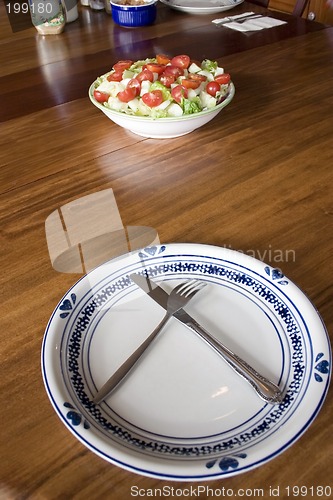 Image of Bowl of Salad and an Empty Plate