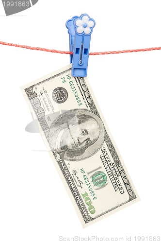 Image of One hundred dollar on clothesline