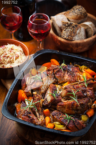 Image of Roasted pork belly on vegetables with sauerkraut