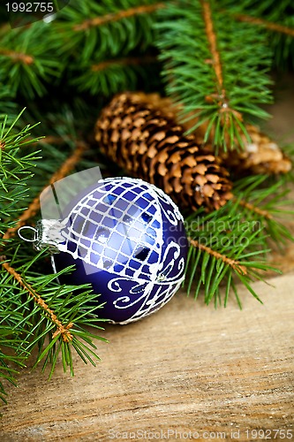 Image of christmas fir tree with pinecones and decoration