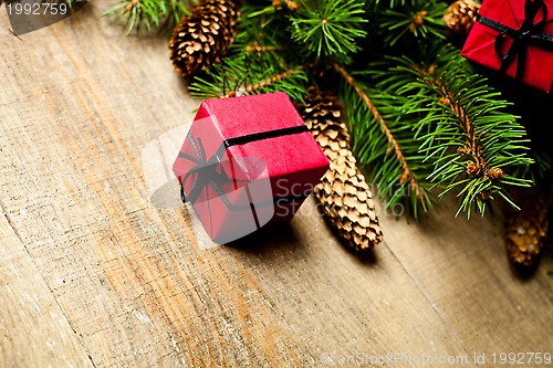 Image of christmas fir tree with pinecones and decorations 