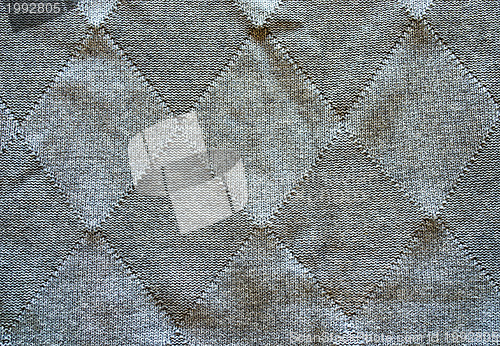 Image of Knitted wool pattern rhomb form grey background  