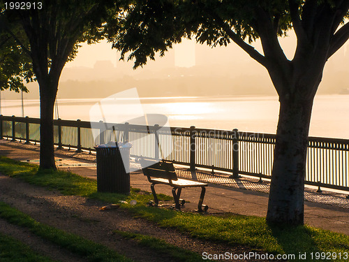 Image of Park bench at rivers' edge