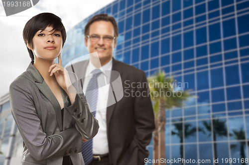 Image of Mixed Race Woman and Businessman in Front of Building