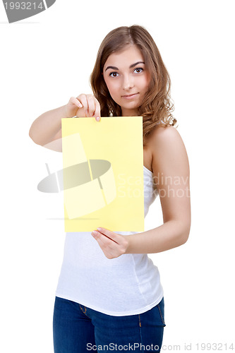 Image of Lovely girl shows a blank A4 sheet of yellow