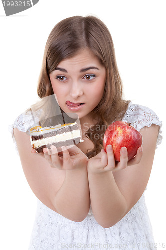 Image of Girl with apple and cake in hands, closeup portrait