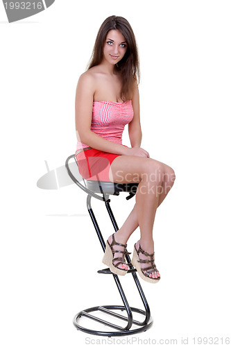 Image of Stock Photo:  Young girl sitting on a bar stool