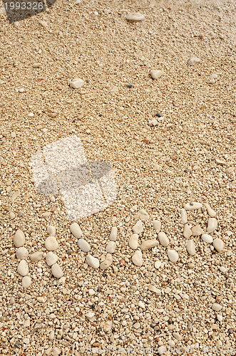 Image of HVAR word made of pebbles