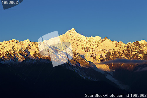 Image of Sunrise at snow mountains