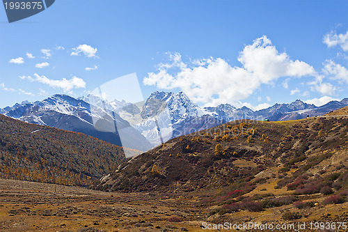 Image of Snow mountain landscape in autumn