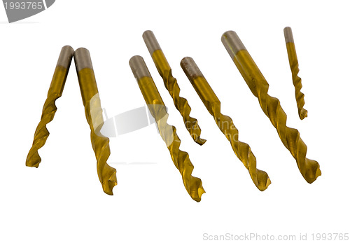 Image of Various size golden drill bits isolated on white 