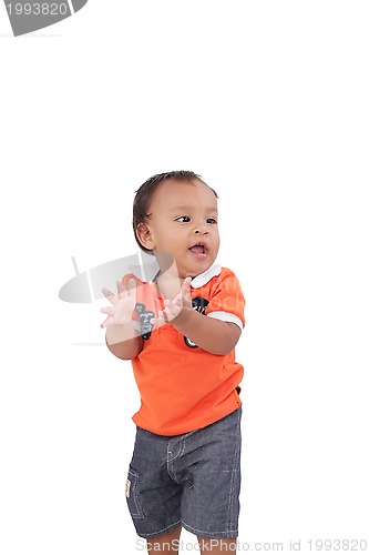 Image of Happy one year old baby boy walking on white background 