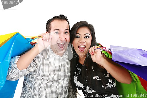 Image of Beautiful young couple with shopping bags. Isolated on white 