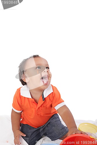 Image of Adorable 1 year old hispanic boy with a big smile looking up