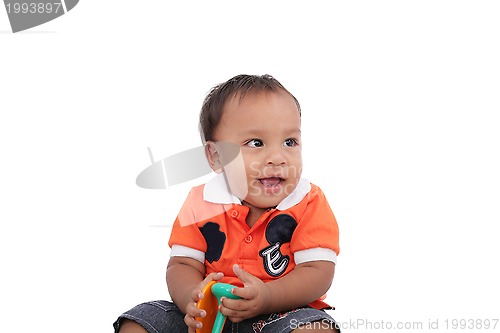 Image of Adorable one year old child playing and having a good time, isol