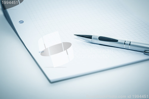 Image of notepad and ballpen