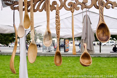 Image of handmade carved spoons sell outdoor market 