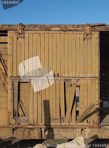 Image of Broken door of abandoned wooden railway car 