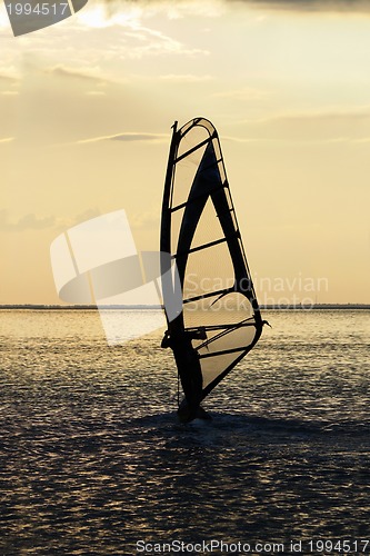 Image of windsurfer on the sea bay surface