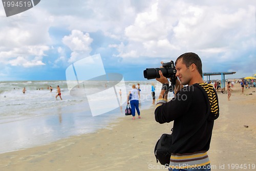 Image of Man photographer takes shot