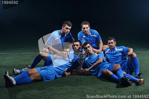 Image of soccer players celebrating victory