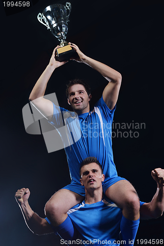 Image of soccer players celebrating victory
