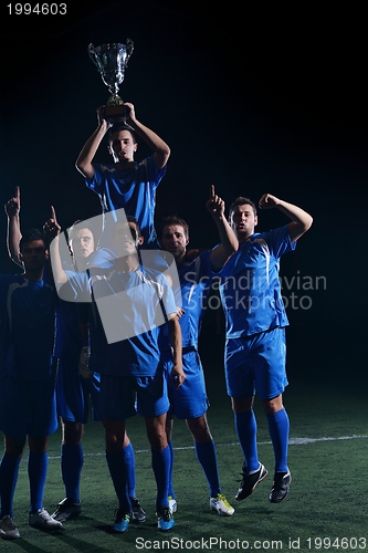 Image of soccer players celebrating victory