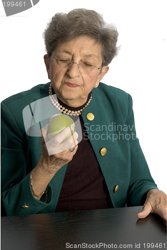 Image of senior woman with apple