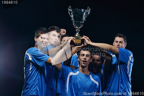 Image of soccer players celebrating victory