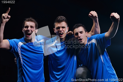 Image of soccer players celebrating victory