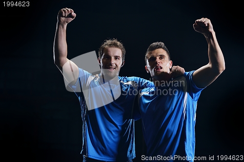 Image of soccer players celebrating victory