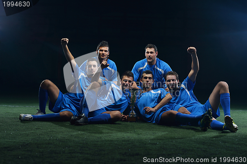 Image of soccer players celebrating victory