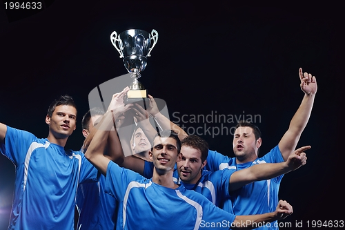 Image of soccer players celebrating victory