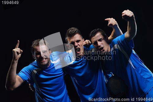 Image of soccer players celebrating victory