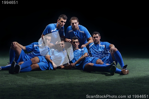 Image of soccer players celebrating victory