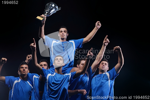 Image of soccer players celebrating victory