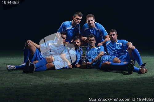 Image of soccer players celebrating victory