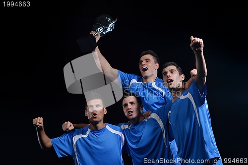 Image of soccer players celebrating victory