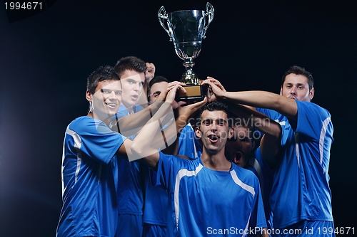 Image of soccer players celebrating victory