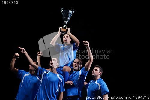 Image of soccer players celebrating victory