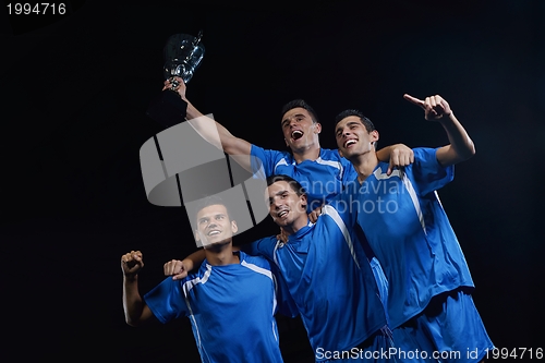 Image of soccer players celebrating victory