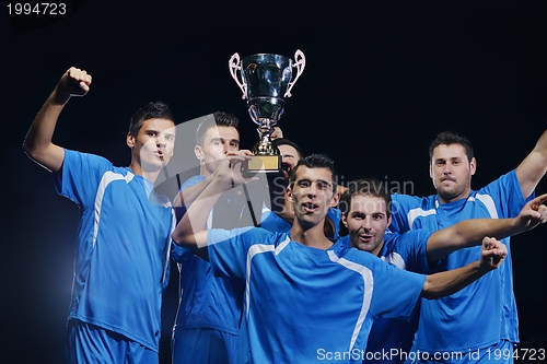 Image of soccer players celebrating victory