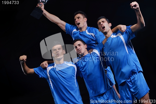 Image of soccer players celebrating victory