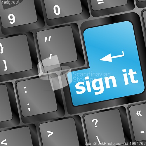 Image of sign it or login concept with key on computer keyboard