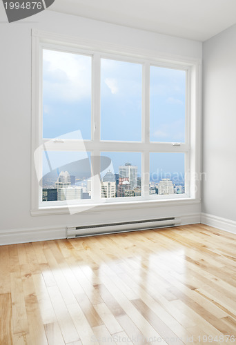 Image of Downtown seen through the window of a room