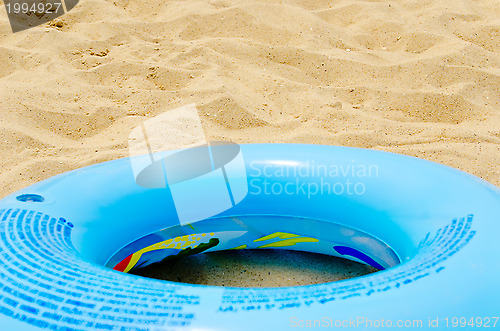Image of blue circle on sand