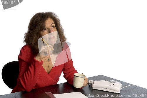 Image of woman at desk thinking