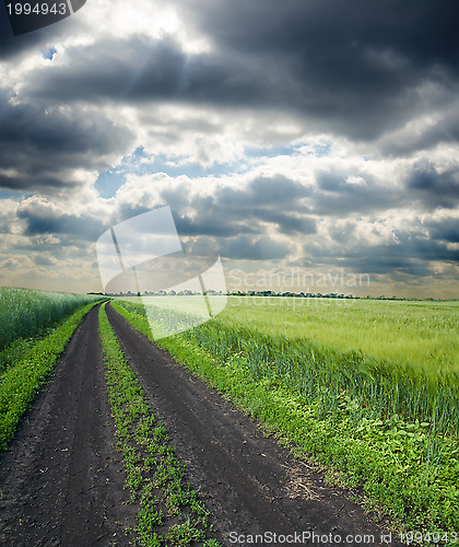 Image of dirty road to cloudy horizon